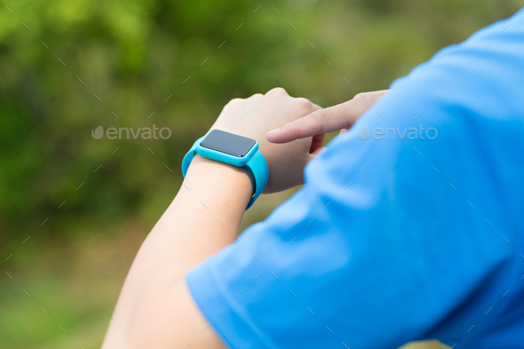 Man using smartwatch with sporty wear - Stock Photo - Images