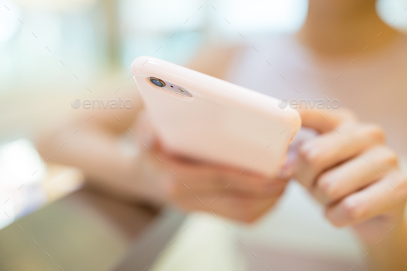 Woman looking at mobile phone - Stock Photo - Images