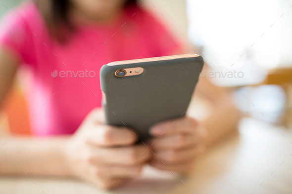 Woman use of mobile phone at cafe - Stock Photo - Images