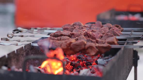 Barbecue meat on skewers, beautifully browned meat on the grill. Cooking shashlik of pork meat alt