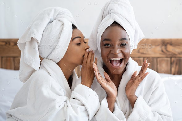 Pretty african women having girlish day at home Stock Photo by