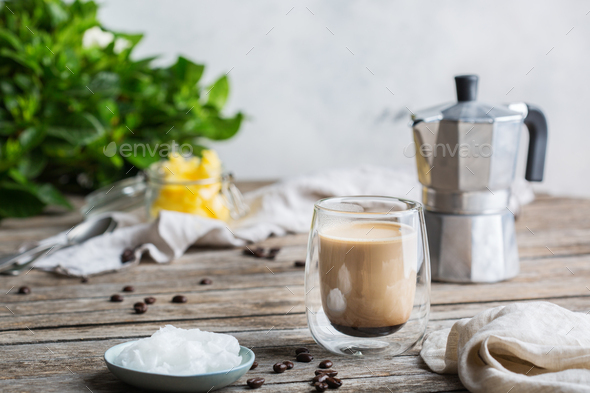 Keto, ketogenic bulletproof coffee with coconut oil and ghee butter - Stock Photo - Images