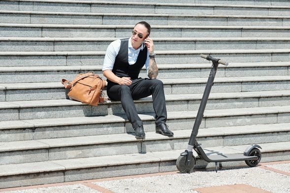 Entrepreneur sitting on steps - Stock Photo - Images