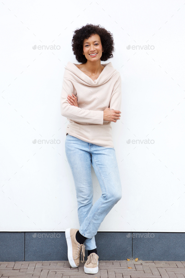 African Woman with Jeans and Crossed Arms Stock Image - Image of