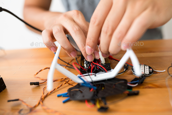 Connecting the wire of flying drone - Stock Photo - Images