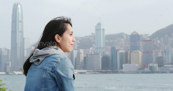 Woman enjoy the view of Hong Kong city - Stock Photo - Images