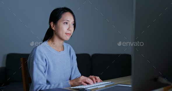 Asian Woman work on computer at home - Stock Photo - Images