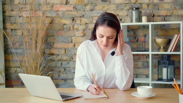 Confident Smiling Businesswoman Having a Video Conversation in Office alt