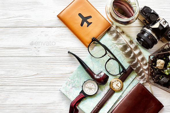 Map, passport, money, compass, and glasses, photo camera, pipe