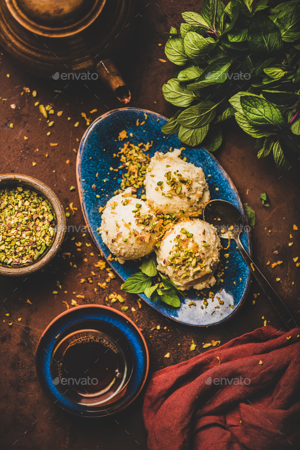 Turkish dessert semolina helva with pistachio, mint and tea - Stock Photo - Images