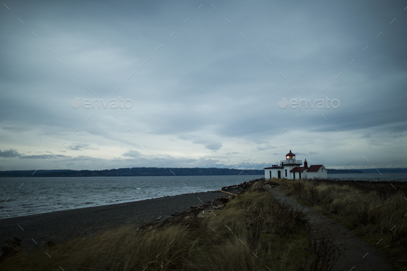 The lighthouse at dusk at Discovery Park in Seattle, WA. - Stock Photo - Images