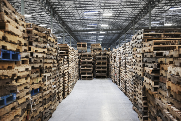 Stacked pallets in warehouse - Stock Photo - Images