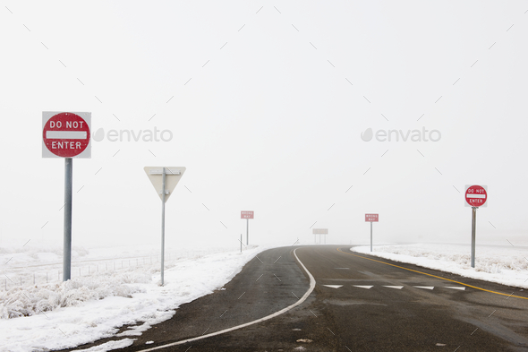 ‘Do Not Enter’ Signs by Snowy Road