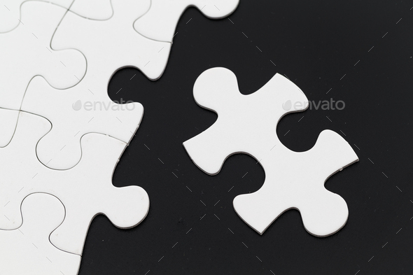 Jigsaw puzzle on black background - Stock Photo - Images
