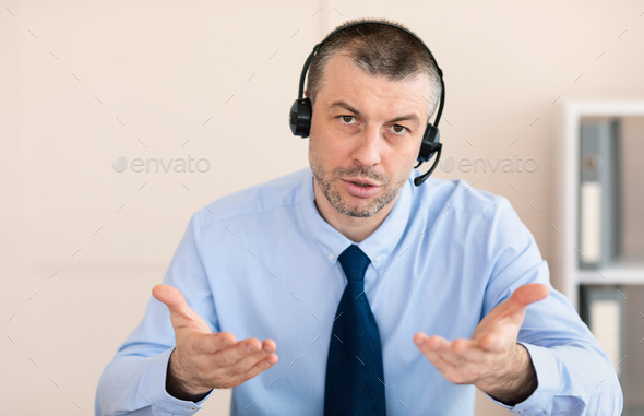Man Talking With Customer Solving Problem Working In Call Center - Stock Photo - Images