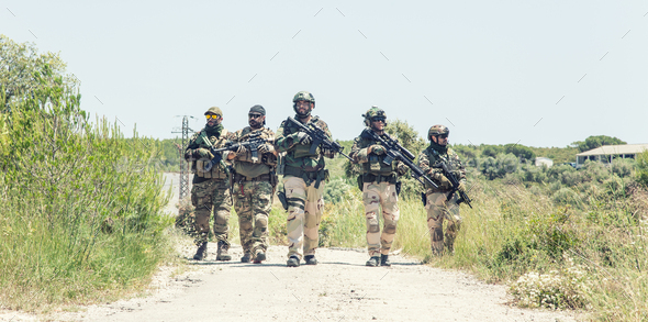 Army soldiers running on road in abandoned area - Stock Photo - Images