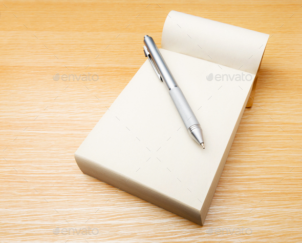 Memo pad and pen on the table