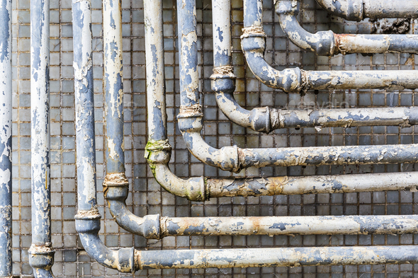 Series of parallel old pipes on wall - Stock Photo - Images