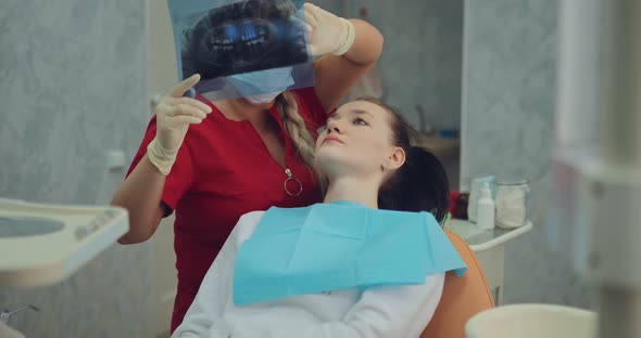 Young Pretty Girl at the Reception at the Dentist in a Modernly Equipped Clinic alt