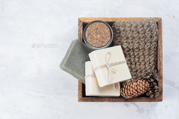 Spa, beauty skincare body concept. Handmade soap, coffee body scrub and body brush in wooden box