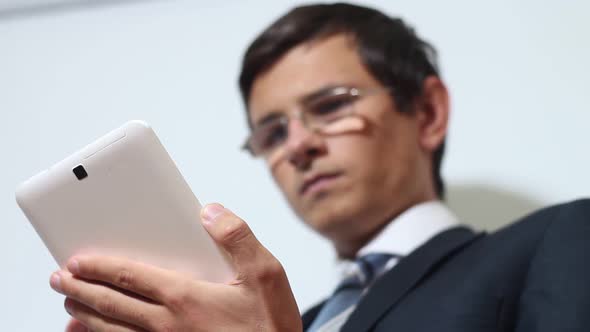 Businessman Using Tablet