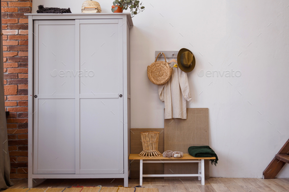 Rustic eco style interior made of natural materials. Wooden wardrobe in the room