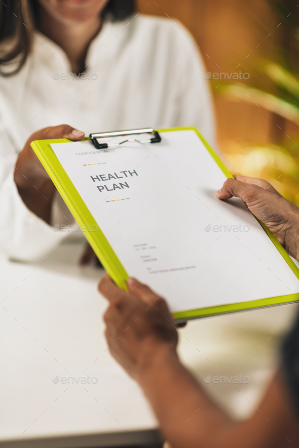 Functional medicine doctor giving personal health plan to the client