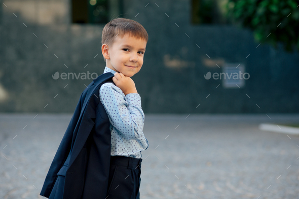 School boy posing in formal wear, elegant clothes