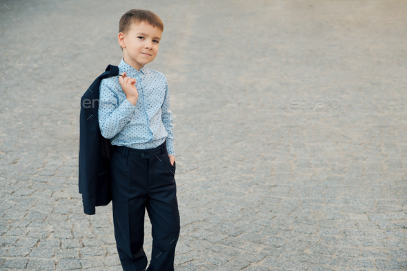 Portrait school boy posing in elegant clothes