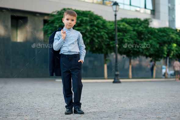 School boy posing in formal wear, elegant clothes