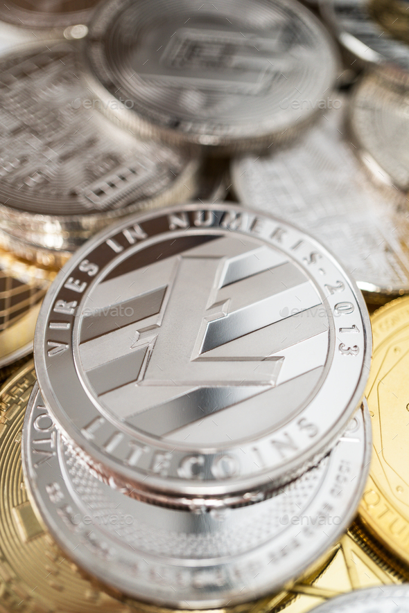 Close-up Of Litecoin Physical Coin On Stack Of Many Other Cryptocurrencies - Stock Photo - Images
