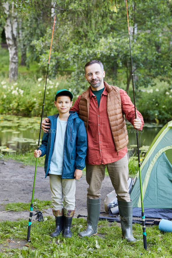 Portrait of Father and Son at Fishing Trip Stock Photo by