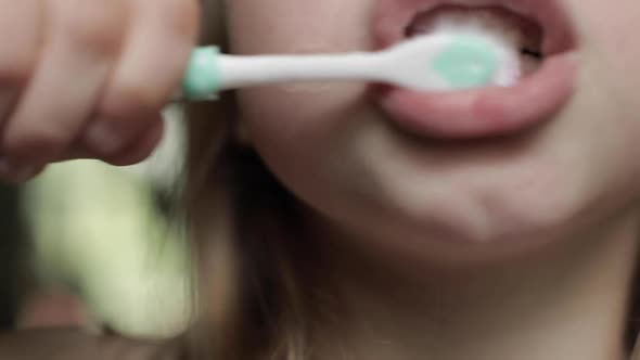 Little Girl Brushing Her Teeth in the Morning or Before Going to Bed