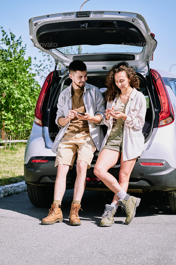 Discussing hiking route using phone apps - Stock Photo - Images