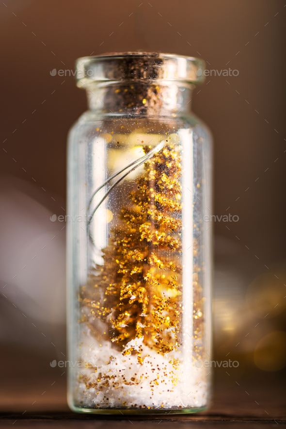 Miniature Gold Christmas Trees in Glass Baubles Stock Photo by Manuta