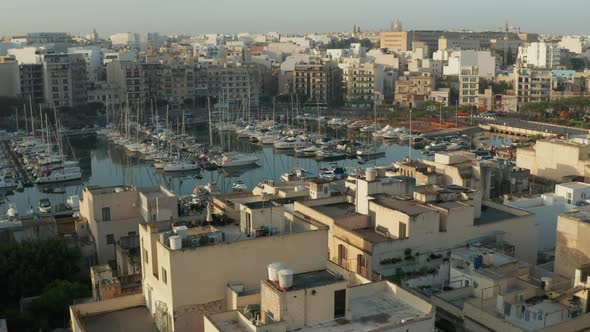 Small Town on Malta Island View on Harbour with Yachts and Sailboats alt