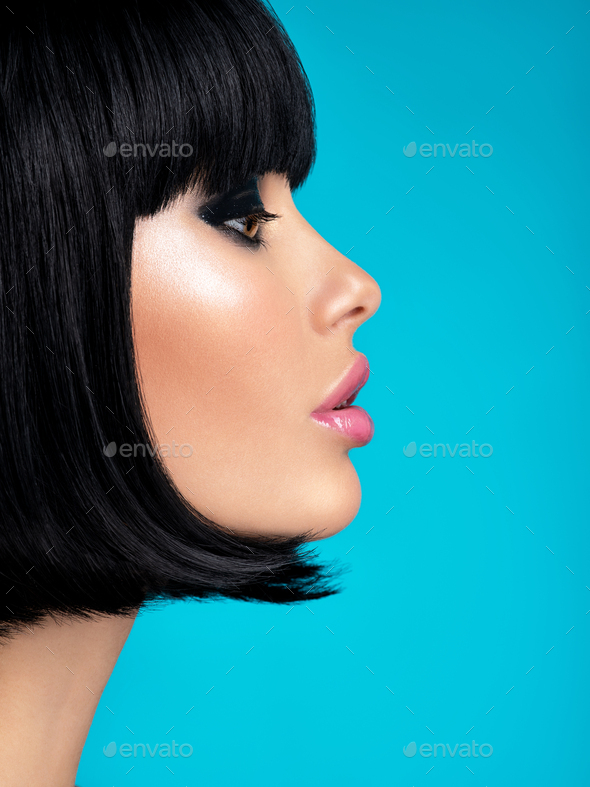 Glamour fashion model with black gloss make-up. Beautiful fashion woman with a bob hairstyle.