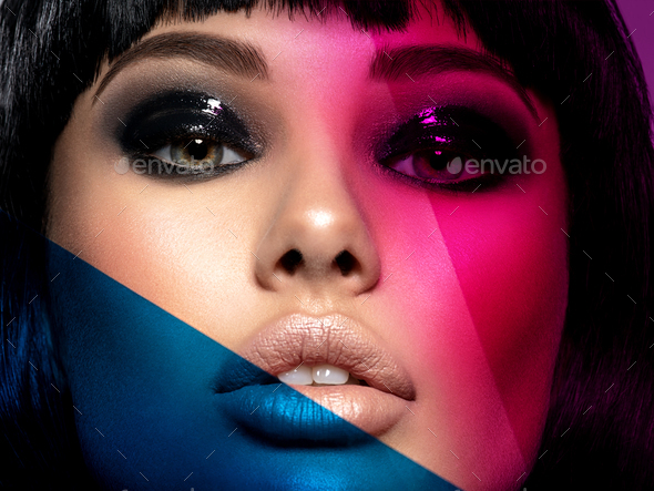 Glamour fashion model with black gloss make-up. Beautiful fashion woman with a colored items.