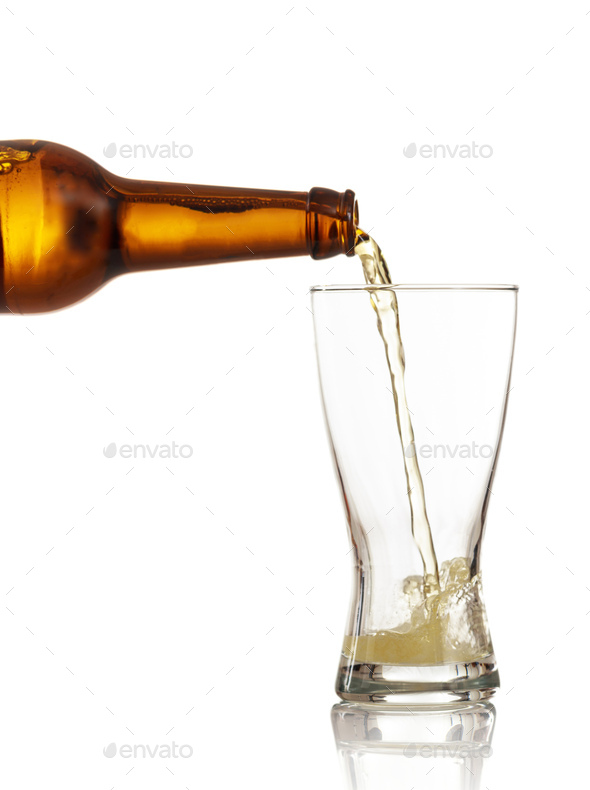 Beer bottle pouring beer in a glass, white background, closeup view Stock  Photo by rawf8