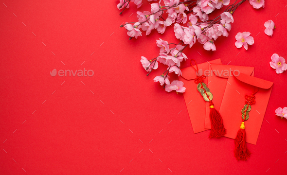 Beautiful pink plum flower and envelope for money, free space