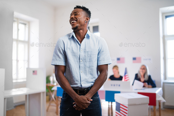 African-american man laughing in the polling place, usa elections
