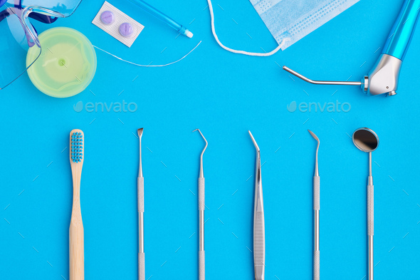 Dentist tools over blue background top view - Stock Photo - Images