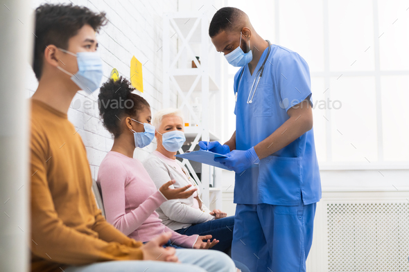 Nurse Working Talking With Patients In Hospital During Covid-19 Vaccination - Stock Photo - Images
