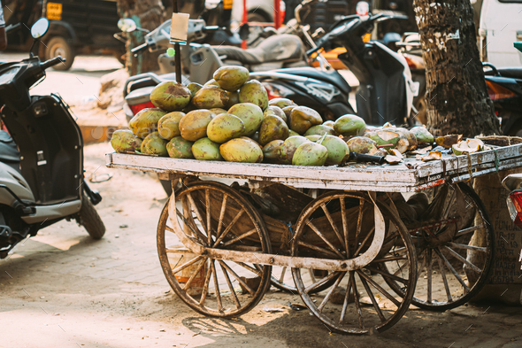 Goa, India. Many Coconuts Piled On Cart For Sale In Grocery Market