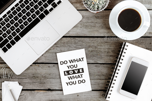 top view of Do what you love and love what you do motivational quote on modern workplace with
