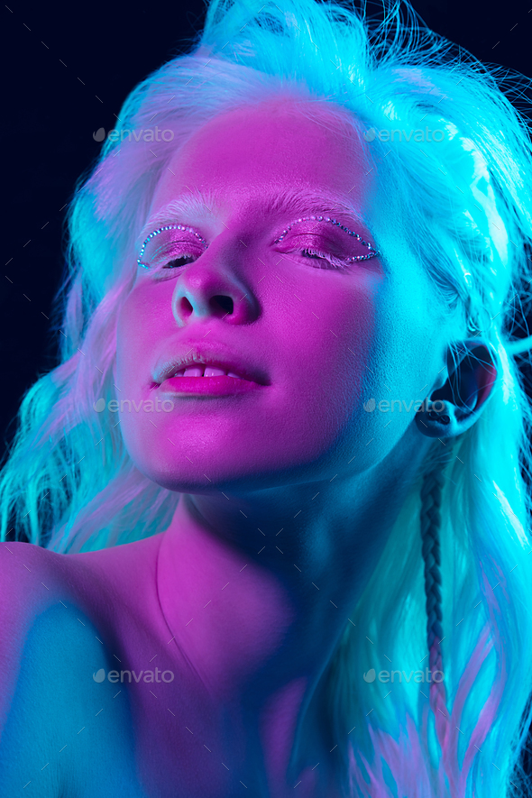 Portrait Of Beautiful Albino Girl Isolated On Dark Studio Background In Neon Light Stock Photo By Master1305
