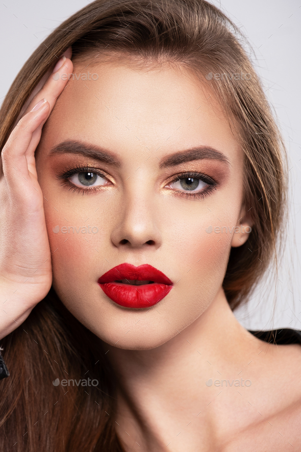 Portrait of beautiful young woman with makeup. Stock Photo by valuavitaly