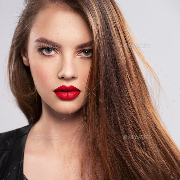 Portrait of beautiful young woman with bright makeup Stock Photo by  valuavitaly