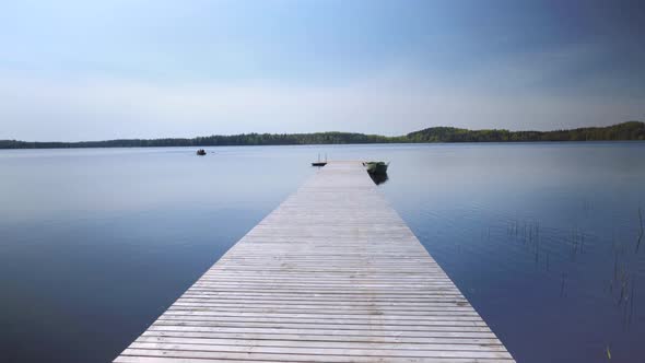 Wooden pier with a boat on the lake