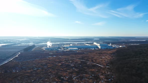 Industrial buildings from above. Aerial view of industrial zone and technology park alt